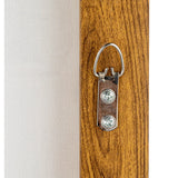 Wooden panel with a metal clip on a white background
