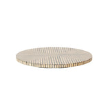Round table with a striped pattern on a white background