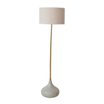 modern floor lamp with grey enameled base, gold stem, and neutral colored drum shade