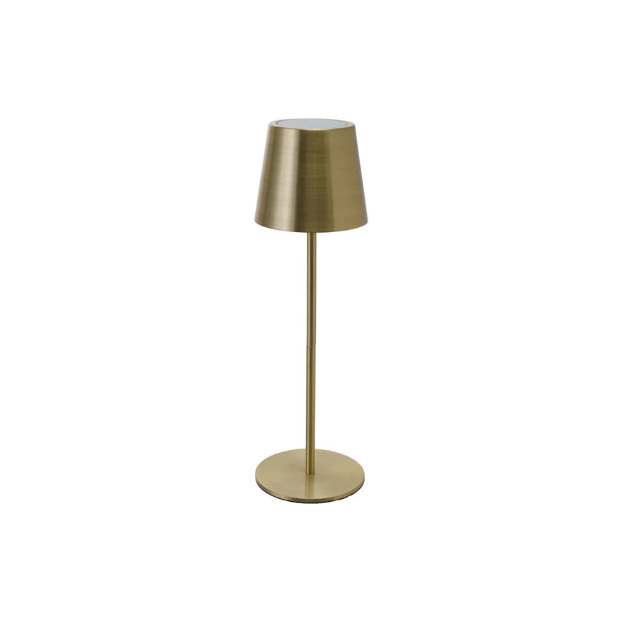 Gold table lamp on a white background
