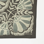 Floral patterned fabric with 'Evelyn' branding on a dark background