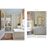 Bathroom interior with a freestanding bathtub, vanity, and decorative elements.