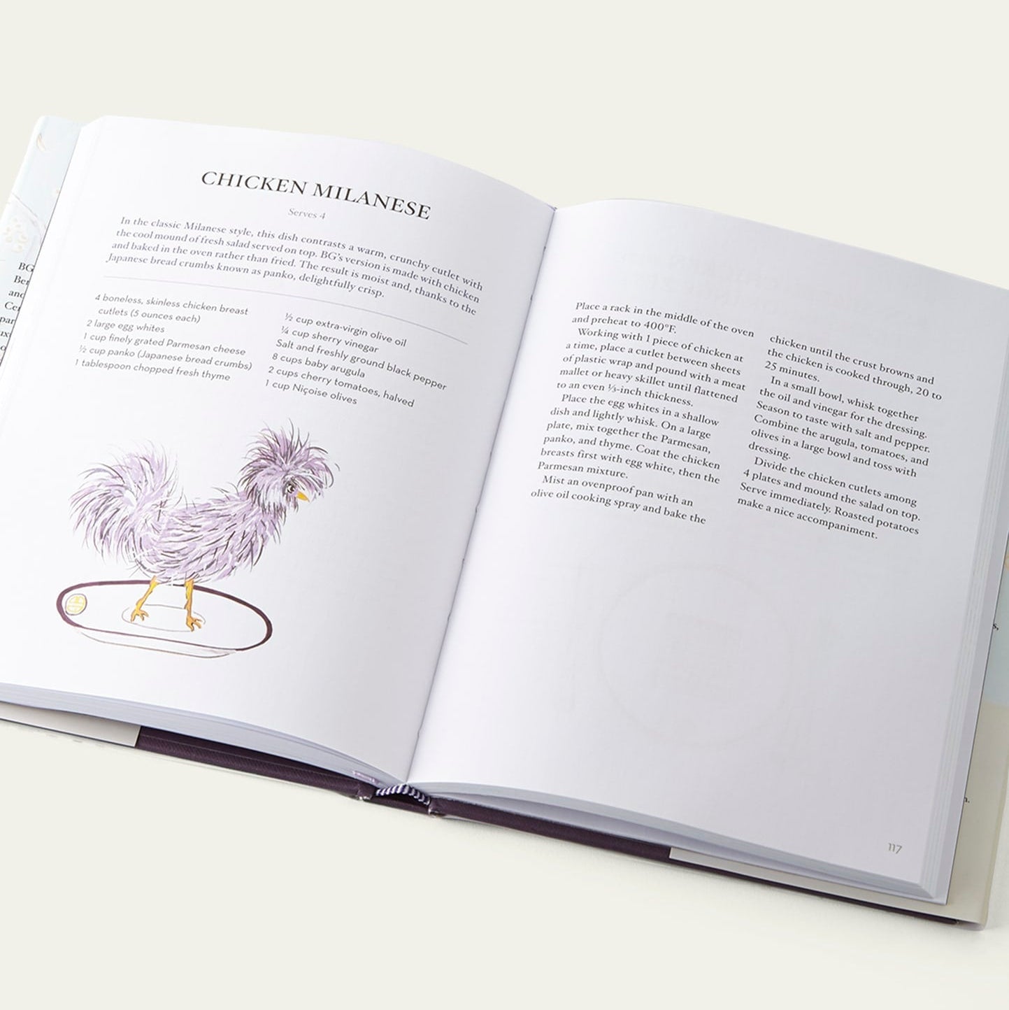 Open Bergdorf Goodman Cookbook book with a recipe for Chicken Milanese on a white background