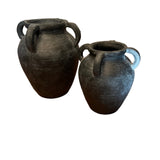 wo black terracotta urns with a weathered finish, featuring dual side handles, 