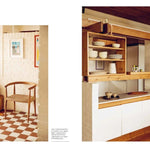 Modern kitchen with wooden shelves and white cabinets, featuring a chair and checkered floor.