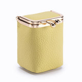Yellow textured clutch bag with gold accents on a white background
