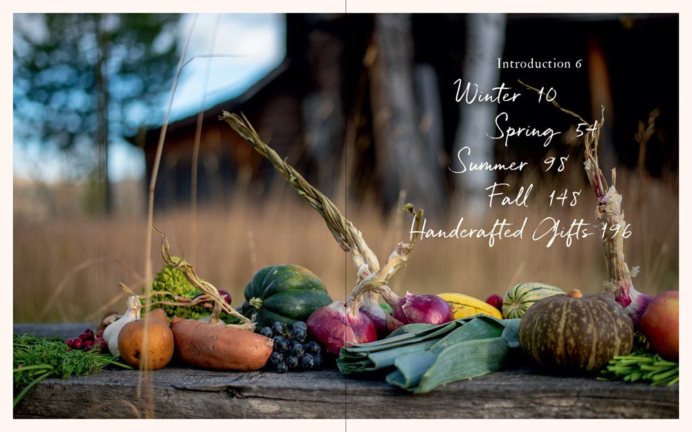 Assorted vegetables on a wooden surface with a blurred natural background