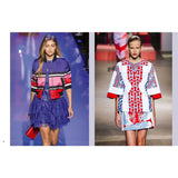 Two models on a runway wearing colorful outfits with geometric patterns.
