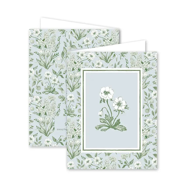 Floral stationery set with a card and envelope featuring green and white floral patterns.