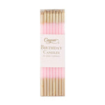 Pack of pink and gold birthday candles with Caspari branding on a white background