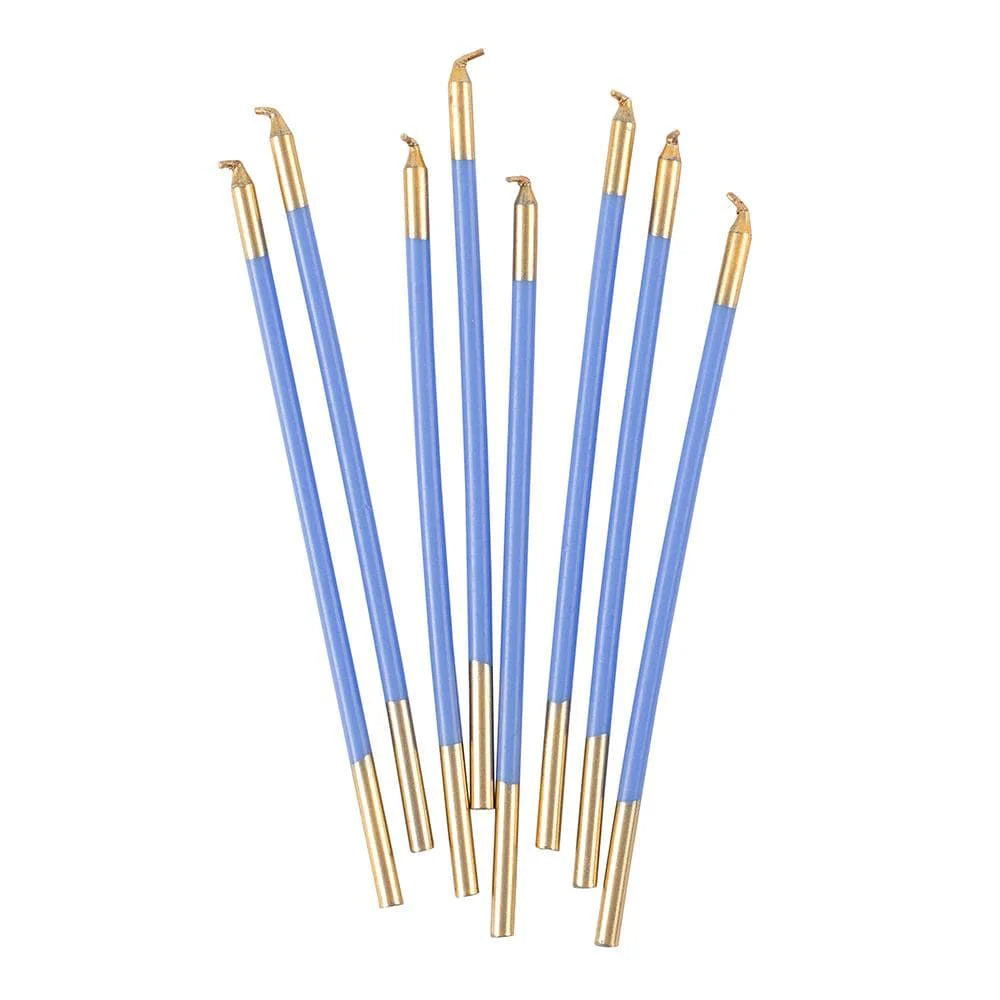 Set of blue and gold candles on a white background