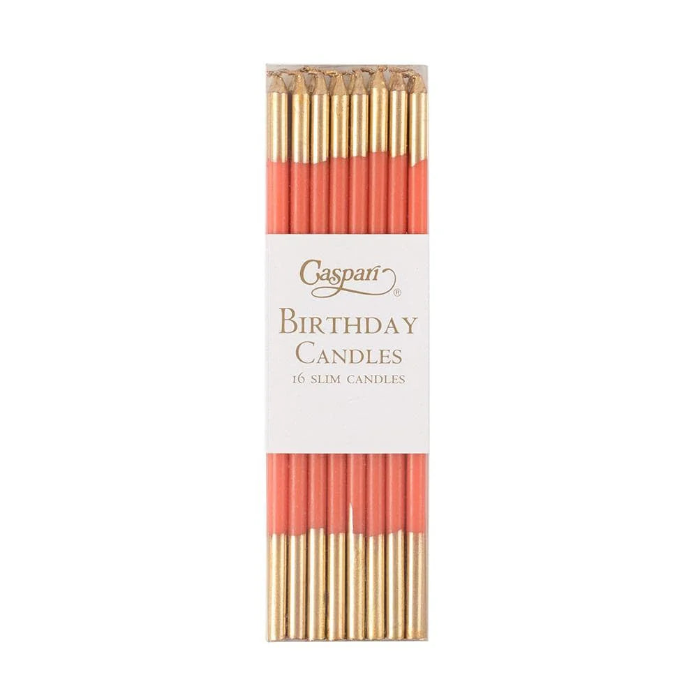 Pack of birthday candles with gold and red design on a white background