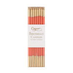 Pack of birthday candles with gold and red design on a white background