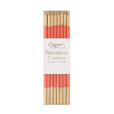 Pack of birthday candles with gold and red design on a white background