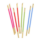 Set of colorful candles with gold tips on a white background