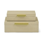 Set of two beige vanity boxes with gold handles on a white background