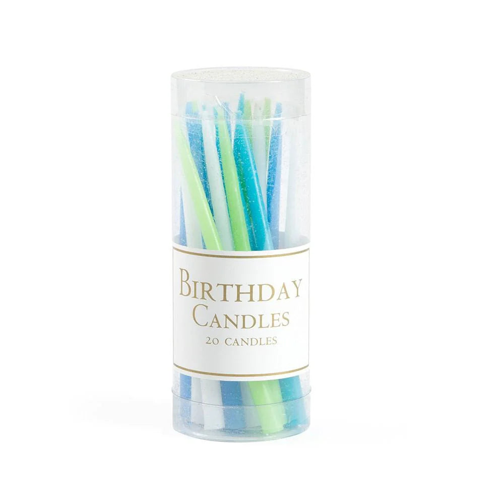 Tube of birthday candles with colorful wicks on a white background