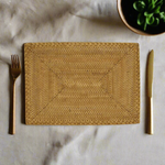 styled caramel woven rattan placemat
