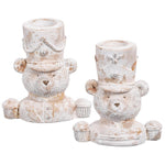 Two decorative bear candle holders with top hats on a white background