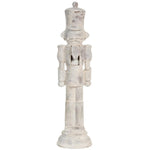 Decorative wooden nutcracker figure with a white distressed finish on a white background