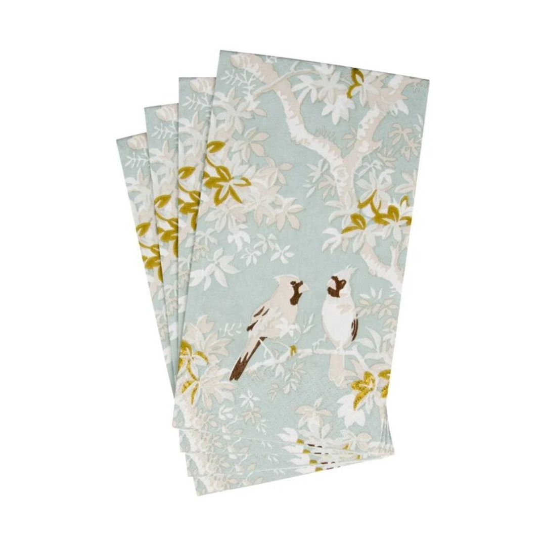 Three matching paper guest towels with a light blue-green background, featuring a white and gray bird perched on a branch with white and yellow leaves.