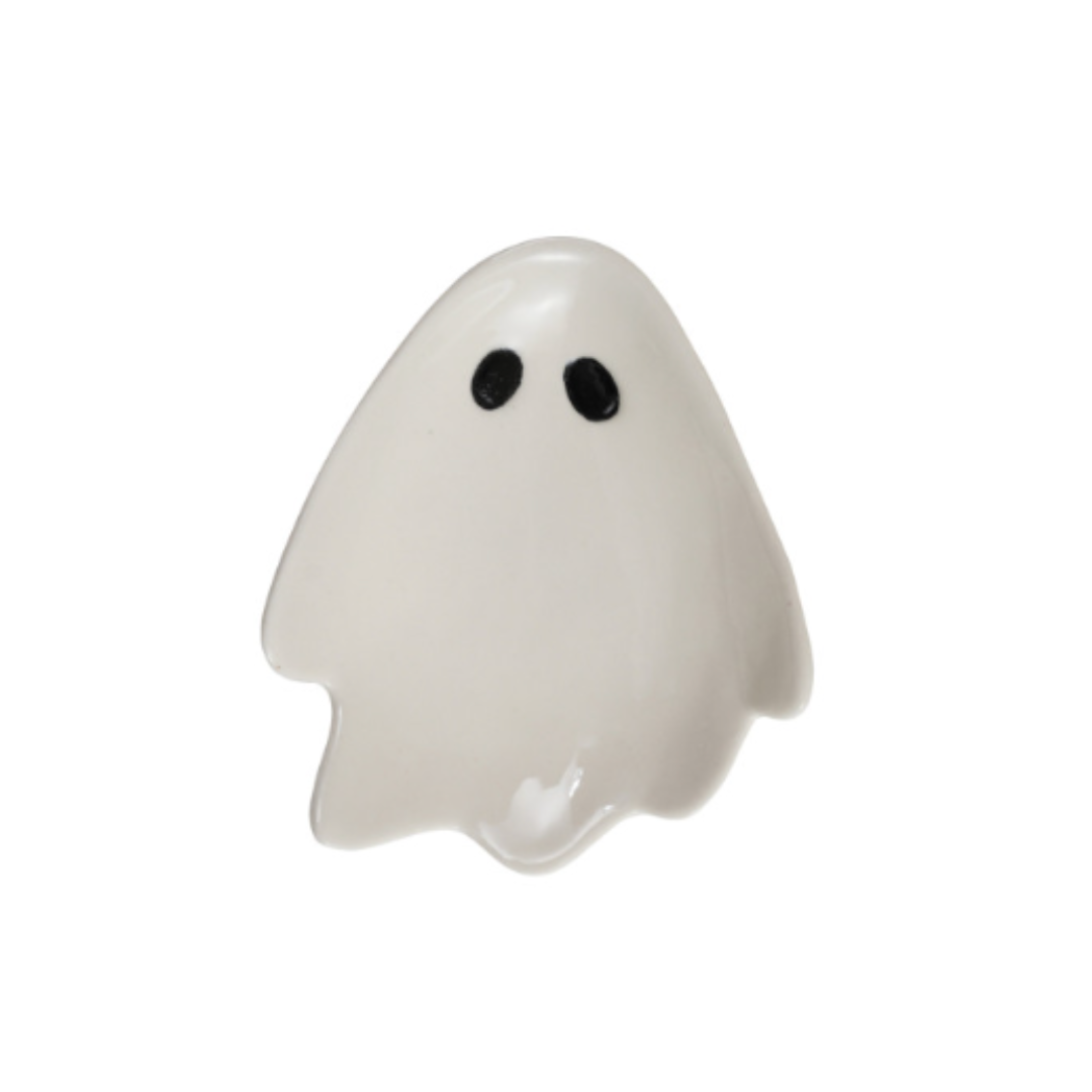 A small white ghost-shaped spoon rest with two black eyes, shown on a plain white background.