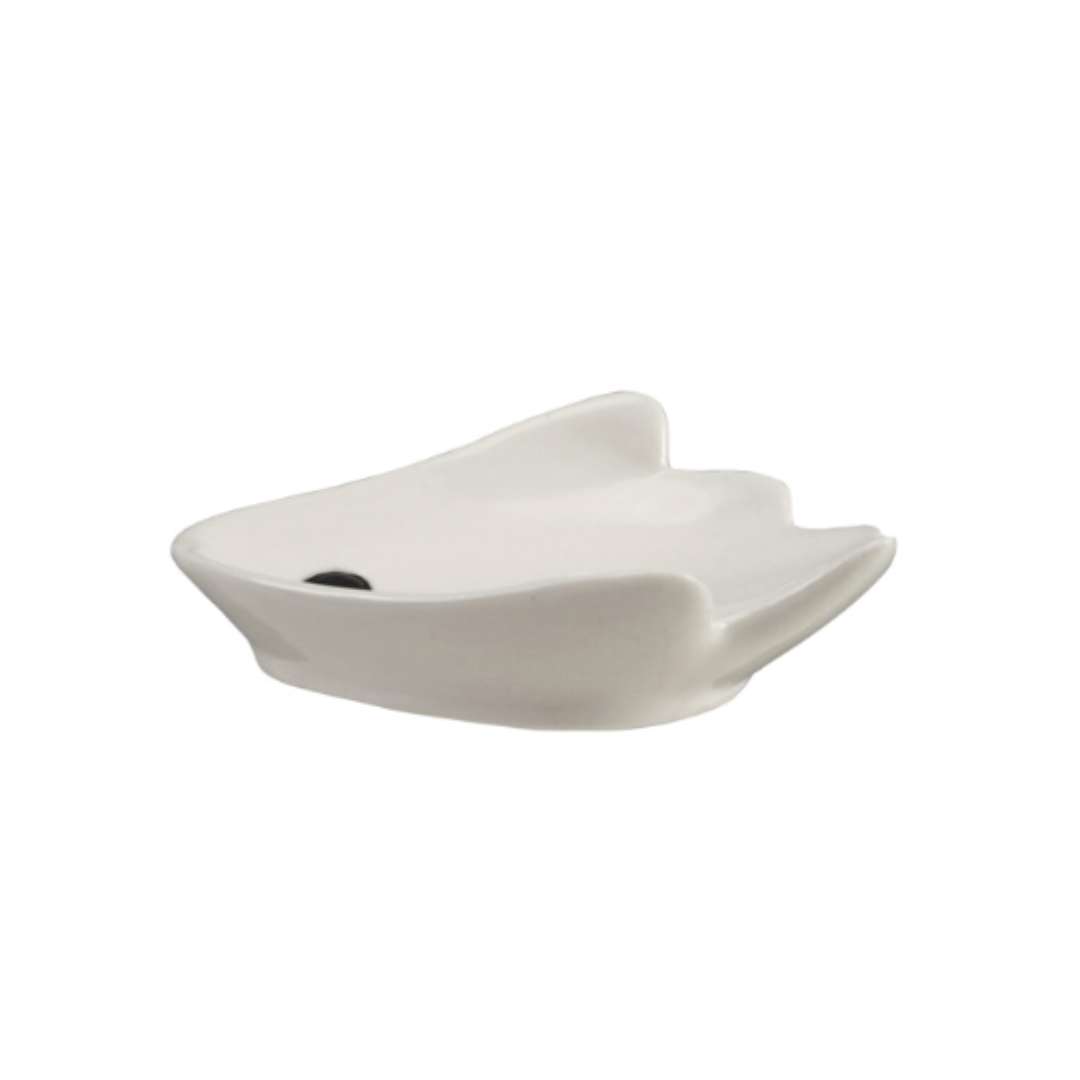 A white ceramic spoon rest with a unique, organic wavy shape of a ghost, shown on a plain white background.