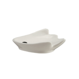 A white ceramic spoon rest with a unique, organic wavy shape of a ghost, shown on a plain white background.