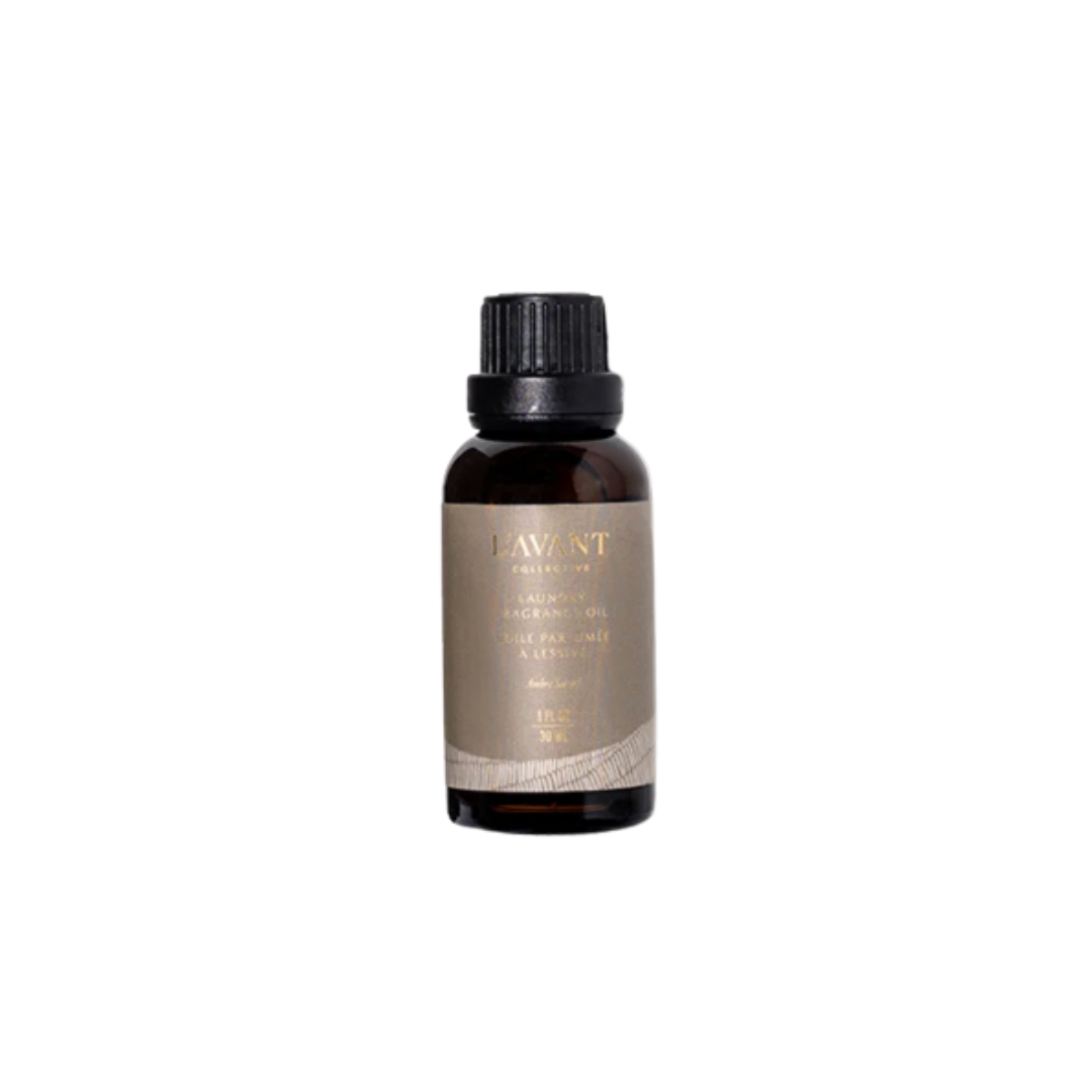 A small amber glass bottle with a black ribbed cap and a taupe label reading LAVANT, centered on a plain white background.