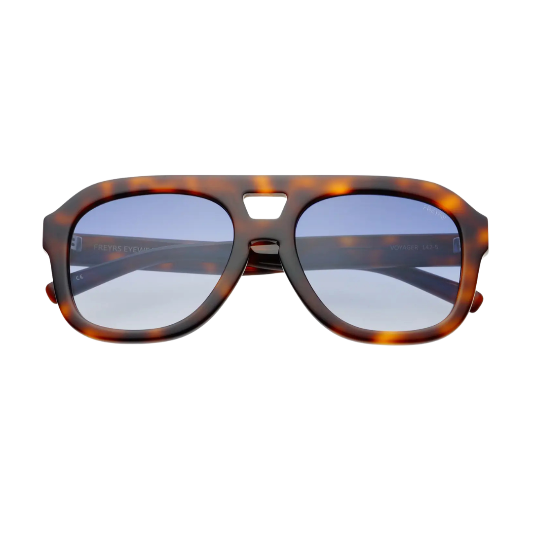 A pair of aviator-style sunglasses with a translucent tortoiseshell frame and light blue-tinted lenses, shown against a plain white background.