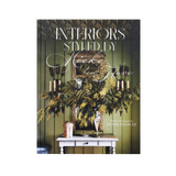 Book cover of 'Interiors Styled by Neeke Low Flave' with decorative elements on a green background.