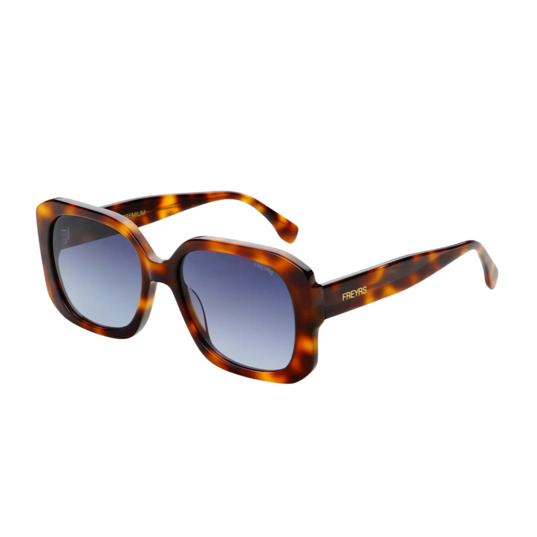 Freyrs Vivian Sunglasses with tortoiseshell frame and blue lenses on a white background