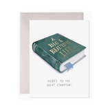 Greeting card with a green book titled 'A Big & Beautiful Life' and text 'Here's to the next chapter!' on a white background.