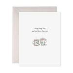 Greeting card with two mugs and text 'i really really wish you lived down the street' on a white background.