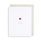 Greeting card with a ladybug illustration and text on a white background