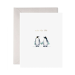 Greeting card with two penguins holding hands and 'mate for life' text on a white background.