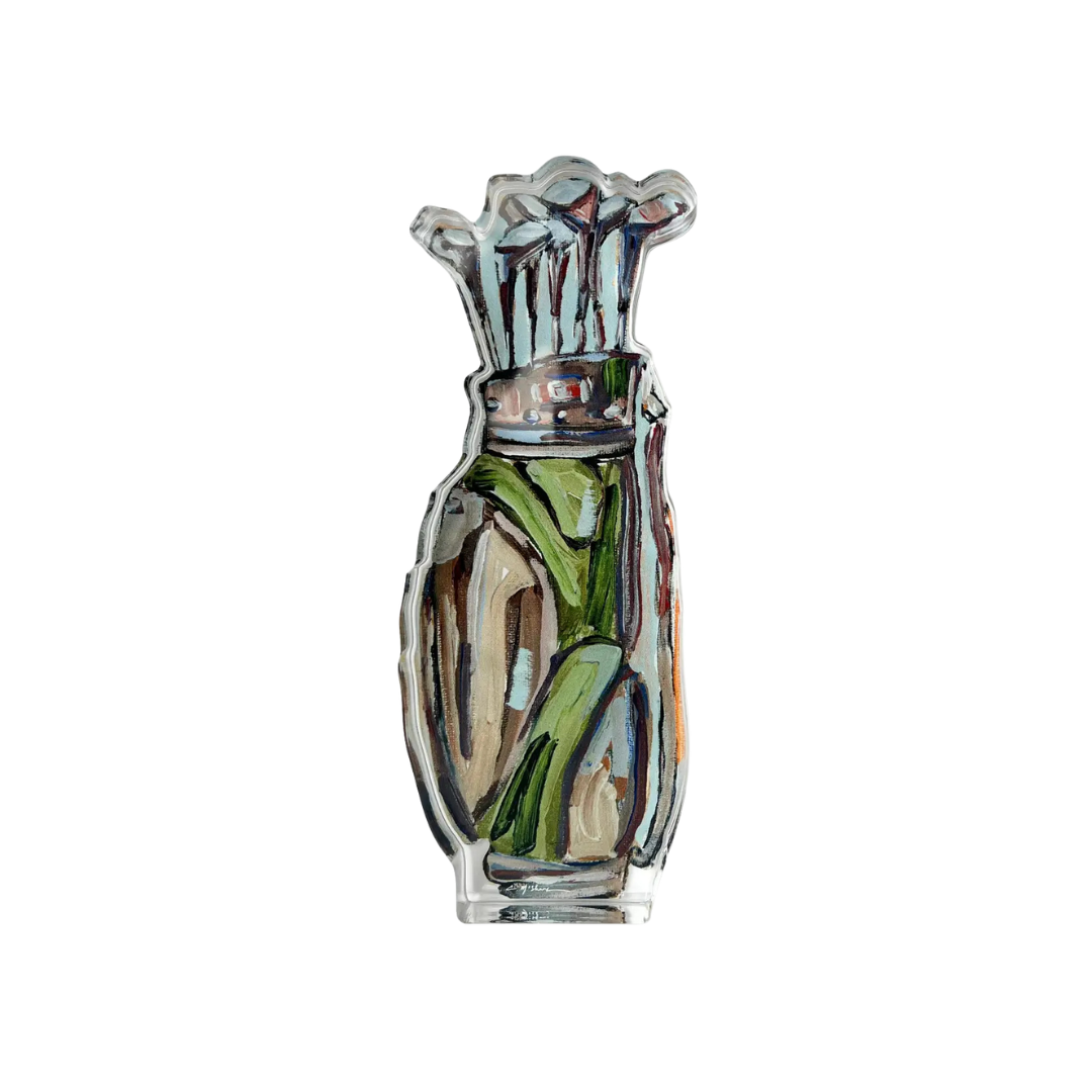 golf club shelfie featuring painted artwork encased in a thick clear freestanding block on white background