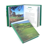 Golf-themed book with a scenic cover and open pages showing text and images.