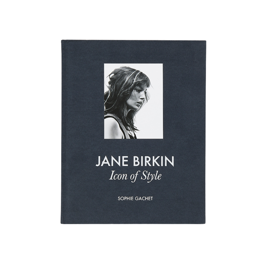 Book cover of 'Jane Birkin: Icon of Style' by Sophie Gachet with a black and white portrait of Jane Birkin on a dark blue background.