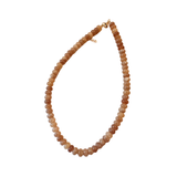 Necklace with brown beads on a white background