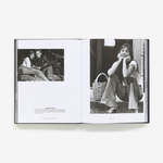 Open book displaying black and white photographs of people on a white background