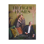 Book titled 'Hilfiger Homes' with a cover featuring two people and palm trees.
