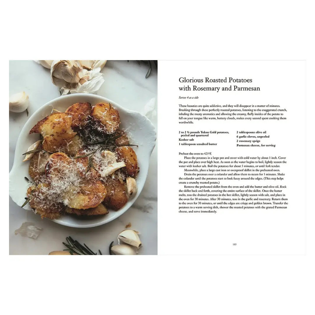 open For the Love of the South cookbook recipe Plate of roasted potatoes with rosemary and Parmesan on a white surface, accompanied by text.