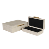Beige jewelry box with black interior on a white background