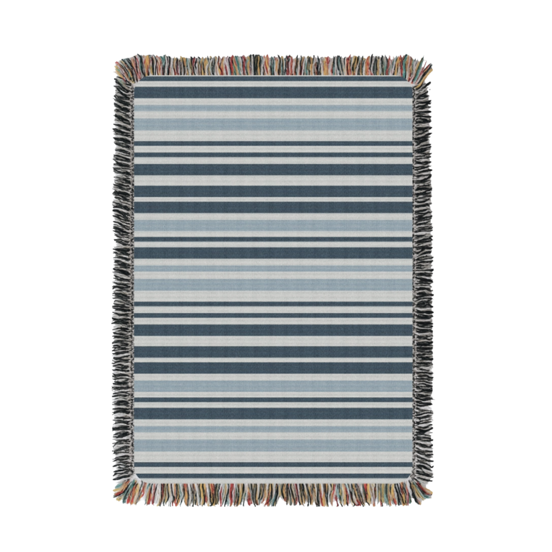 Striped blanket with multicolor fringe on a white background