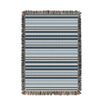 Striped blanket with multicolor fringe on a white background