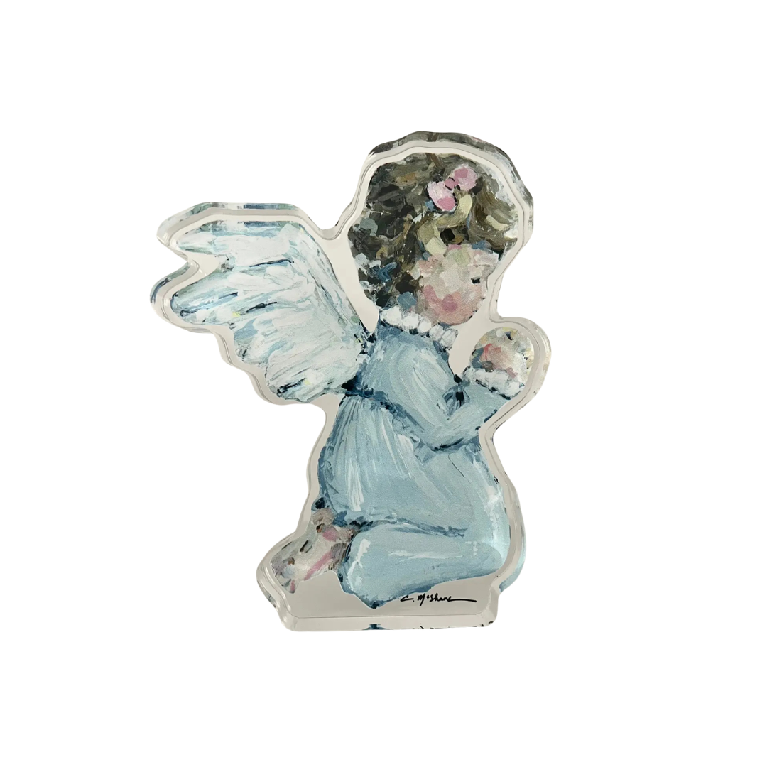 Decorative angel figurine with blue dress and wings on a white background