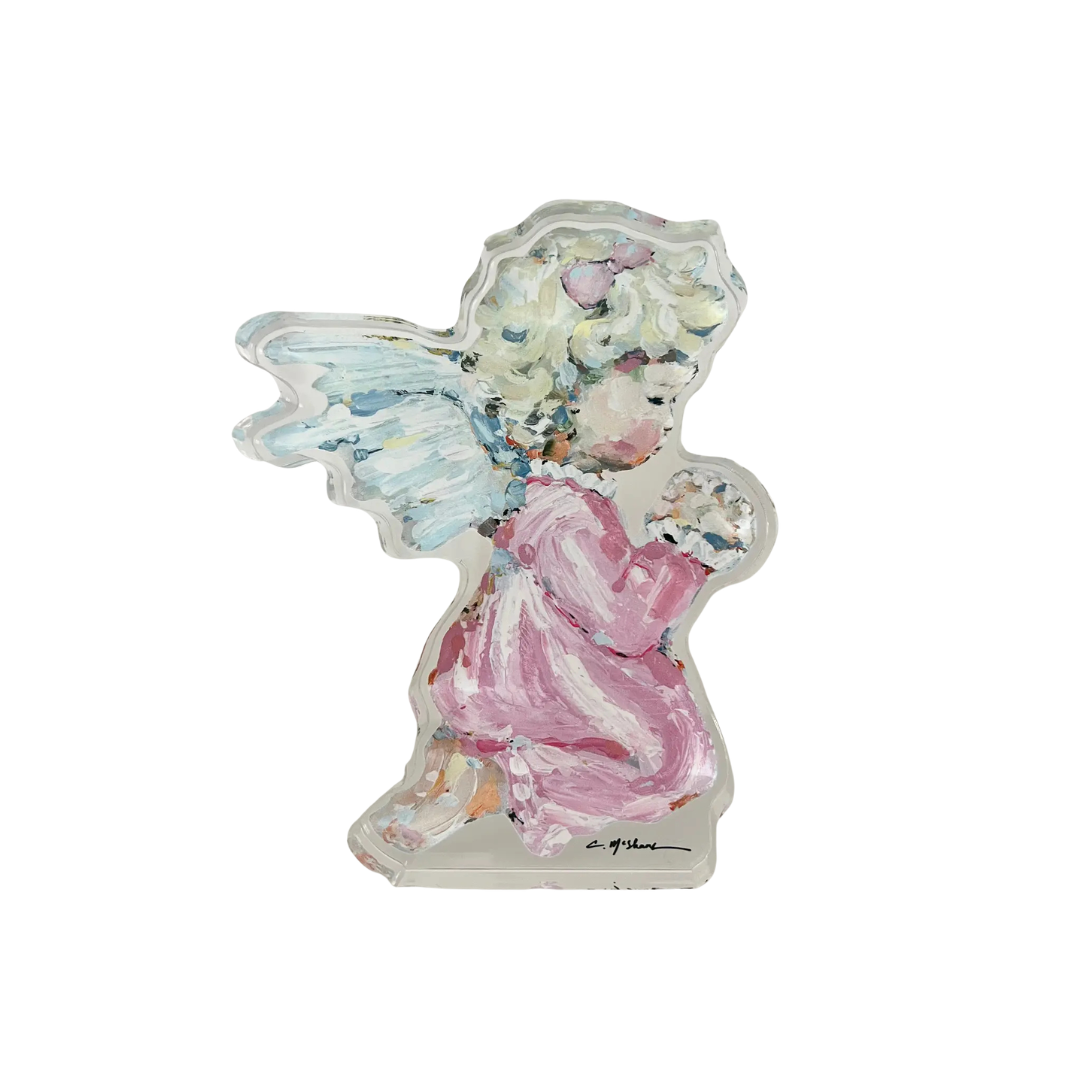 Decorative angel figurine with floral wings on a white background