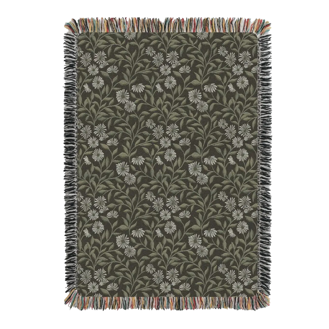 Floral patterned throw blanket with fringe on a white background