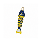 A small fish-shaped charm or pendant with a gold-tone loop at the top, featuring a dark blue body with yellow wavy stripes and white accents, shown on a plain white background.